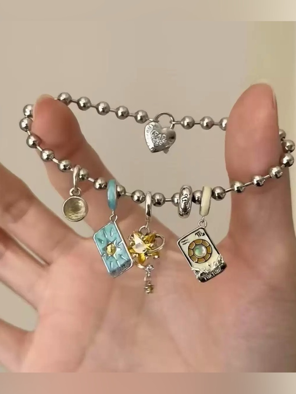 Anthropologie Silver Charm Bracelet with Blue and Cream Enamel Accents